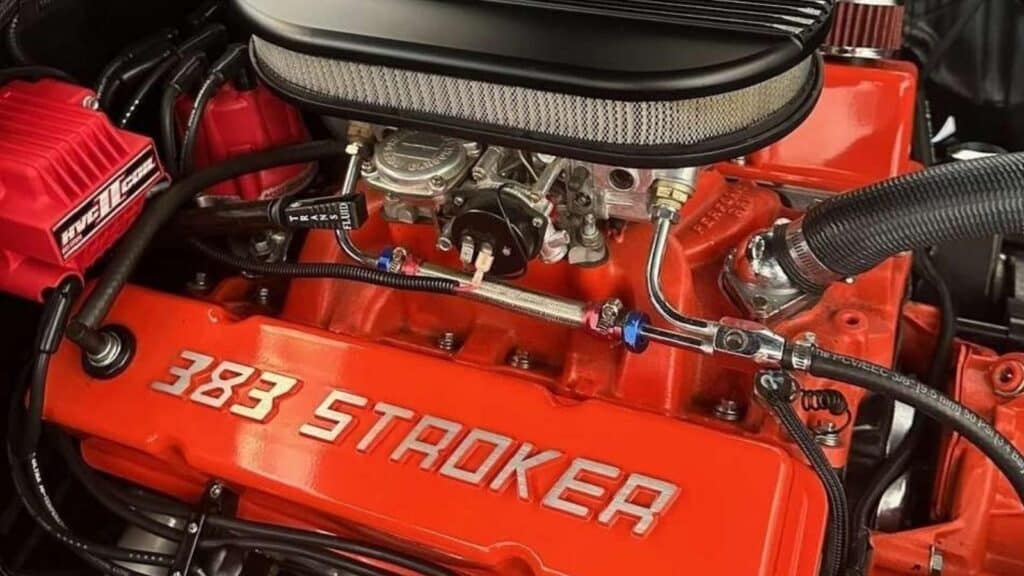 Custom 383 Stroker engine from a stolen 1964 Chevrolet Impala SS, featuring orange valve covers embossed with '383 STROKER'.