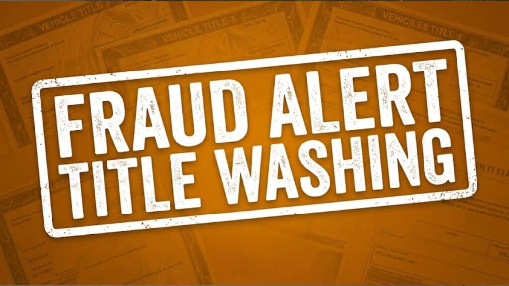 An amber-orange caution graphic with bold text reading 'FRAUD ALERT TITLE WASHING' and 'STOLEN 911', over a subtle pattern of vehicle documents. Indicates a title washing scam fraud warning on Stolen 911.