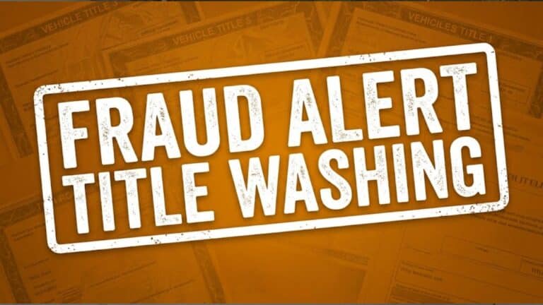 An amber-orange caution graphic with bold text reading 'FRAUD ALERT TITLE WASHING' and 'STOLEN 911', over a subtle pattern of vehicle documents. Indicates a title washing scam fraud warning on Stolen 911.