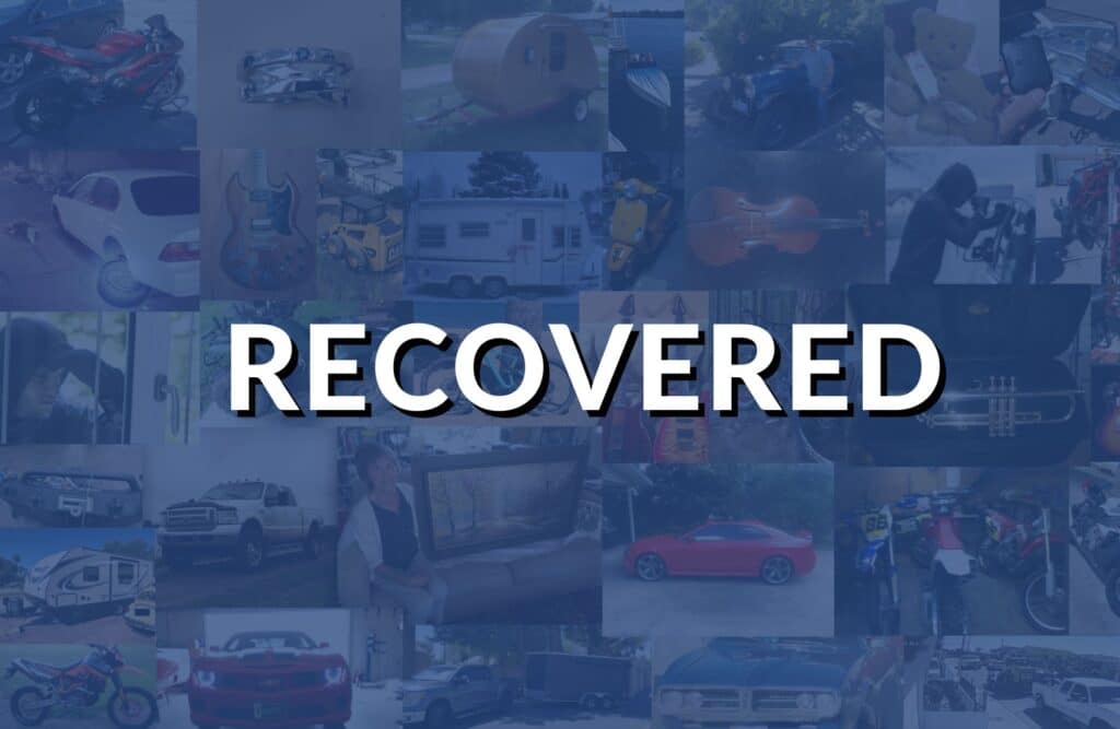 Blue "RECOVERED" stamp graphic indicating successfully recovered stolen property on Stolen 911.