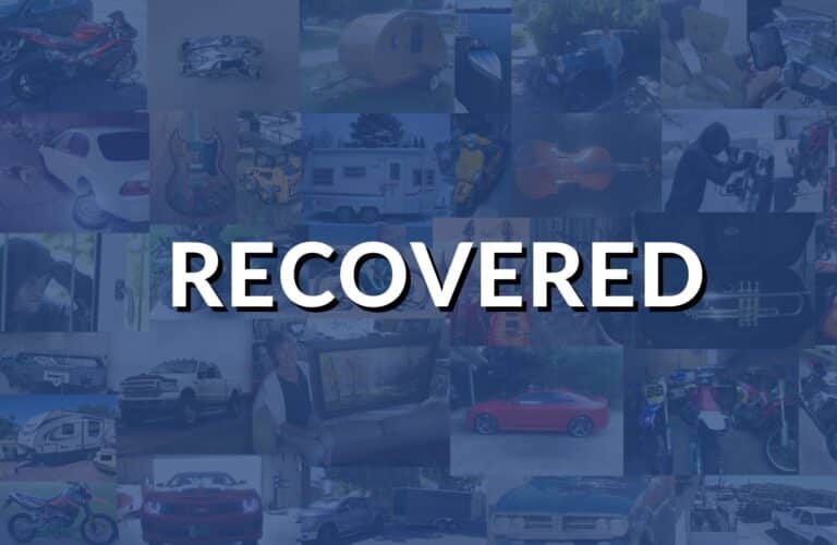 Blue "RECOVERED" stamp graphic indicating successfully recovered stolen property on Stolen 911.