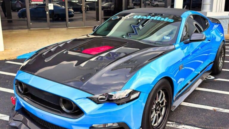 Stolen blue 2022 Ford Mustang Mach 1 (VIN #1FA6P8R08N5553969) missing from Houston, TX." and "Custom performance 2022 Ford Mustang Mach 1 with Texas license plate ZEEGT.