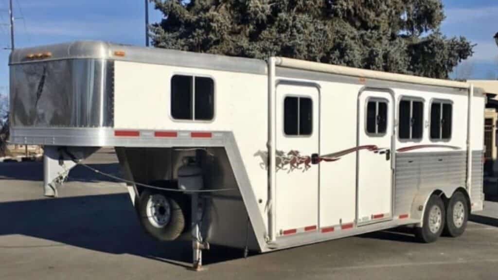White and aluminum 2007 Featherlite 2-horse weekender trailer with galloping horse decals stolen in Enterprise, Oregon.