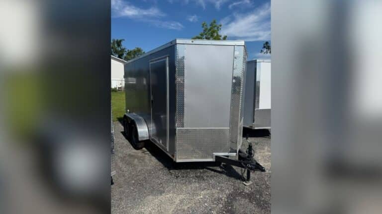 Silver 2025 Xtreme 12-foot dual-axle V-nose utility trailer.