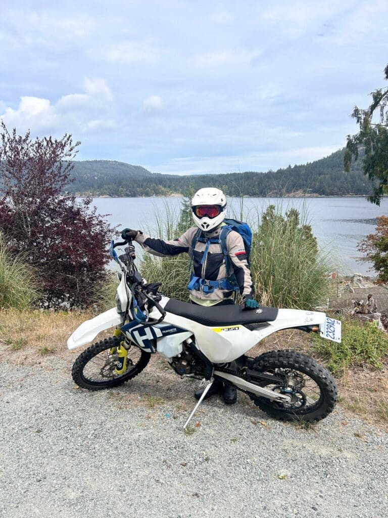 Stolen 2018 Husqvarna FE350S motorcycle (VIN #VBKUAH405JM223943) missing from Vancouver, BC." and "Profile view of the stolen white 2018 Husqvarna FE350S with blue and yellow accents.