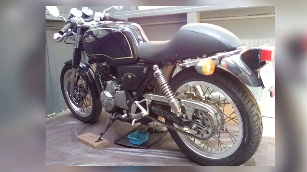 Stolen black 1990 Honda GB500TT vintage motorcycle with VIN JH2PC1612LK100063 parked outdoors.