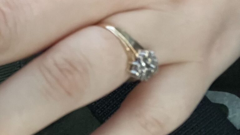 Stolen 10k yellow gold ring featuring a cluster of tiny diamonds.