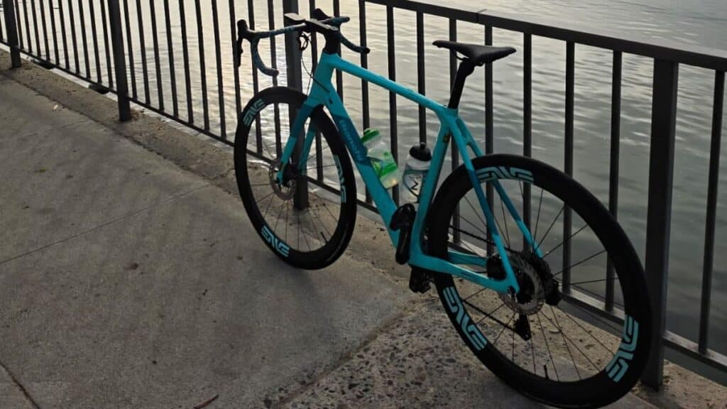 Stolen Celeste blue Bianchi Infinito road bike featuring Enve wheels and Garmin computer, serial number WBK706479V.