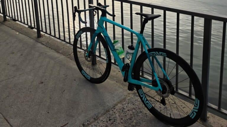 Stolen Celeste blue Bianchi Infinito road bike featuring Enve wheels and Garmin computer, serial number WBK706479V.