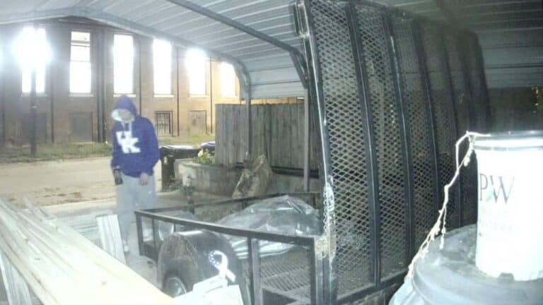 A man is seen just before he steals a trailer from a Louisville, Kentucky car port.